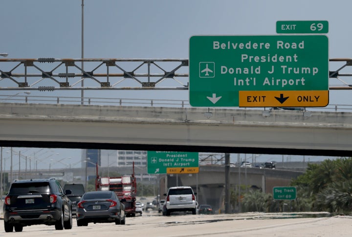 A sign on I-95 directs drivers to the President Donald J. Trump International Airport in Palm Beach, Florida. 