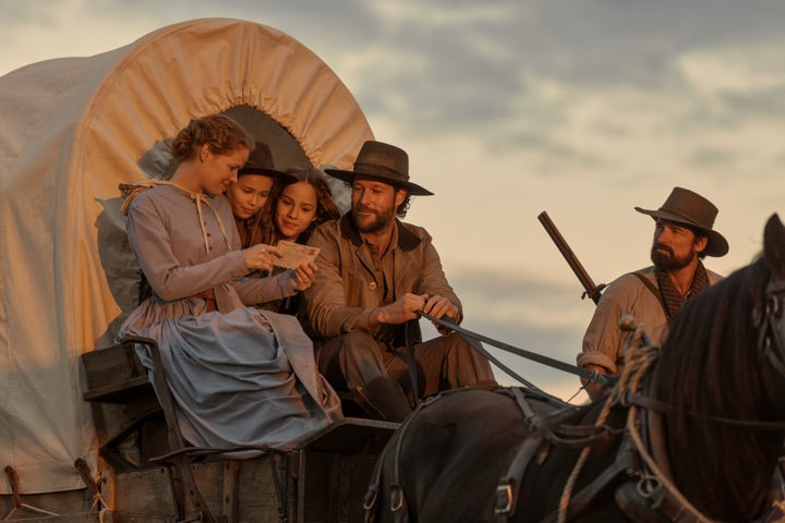 (L to R) Crosby Fitzgerald as Caroline Ingalls, Alice Halsey as Laura Ingalls, Skywalker Hughes as Mary Ingalls, Luke Bracey as Charles Ingalls, Warren Christie as John Edwards in "Little House on the Prairie."