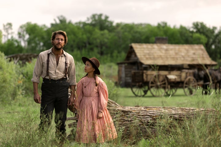 Luke Bracey as Charles Ingalls with Alice Halsey as his daughter Laura Ingalls.