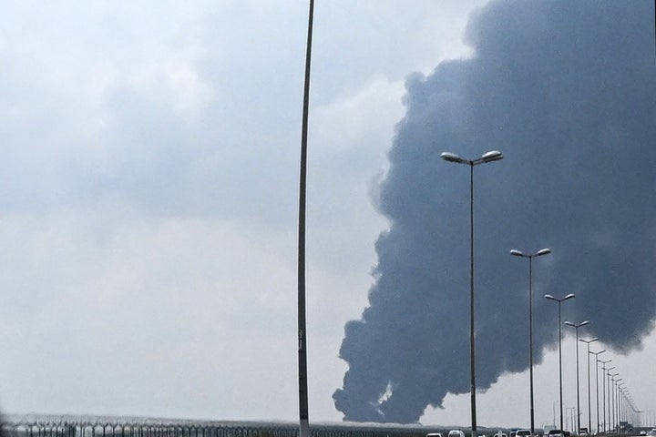 Smoke rises from the area of the Kuwait International Airport after a reported drone strike hit a fuel depot on March 25, 2026. Gulf countries called for Iran to immediately halt its strikes on their territory and provide full reparations.