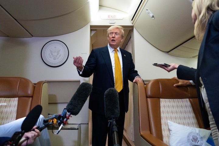 President Donald Trump speaks with reporters in flight on Air Force One after landing at U.S. Air Force Base at RAF Mildenhall, in Suffolk, Eastern England, Wednesday, July 8, 2026. (AP Photo/Alex Brandon)