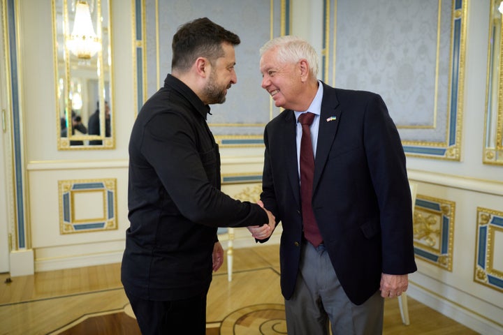 In this photo provided by the Ukrainian Presidential Press Office, Ukrainian President Volodymyr Zelenskyy, left, shakes hands with U.S. Sen. Lindsey Graham, R-S.C. in Kyiv, Ukraine, Friday, July 10, 2026. (Ukrainian Presidential Press Office via AP)