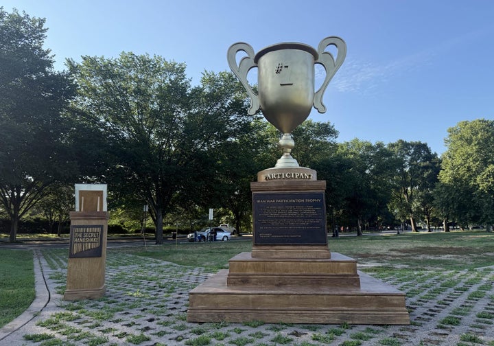 D.C. tourists are invited to drop off their own personal trophies and ribbons at the base of a 10-foot-tall "participation trophy" for Trump, so he can take credit for those, too.