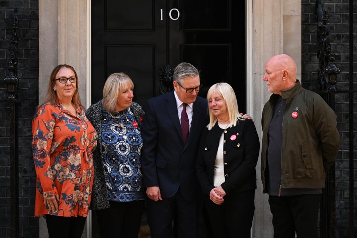 Britain's Prime Minister Keir Starmer, center, meets with Charlotte Hennessy, left, Sue Roberts, second left, Margaret Aspinall, second right, and Steve Kelly, right, at 10 Downing Street Tuesday, Sept. 16, 2025 in London, England.