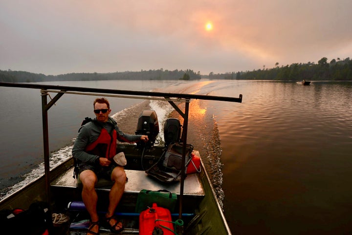 Willy Vosburgh, an Ely resort owner on Moose Lake, heads out to evacuate people deep from the Boundary Waters Canoe Area Wilderness on Tuesday, July 14, 2026. He and Moose Lake outfitters have been helping get people out of the BWCAW since Monday. (Photo by Anthony Soufflé/The Minnesota Star Tribune via Getty Images)