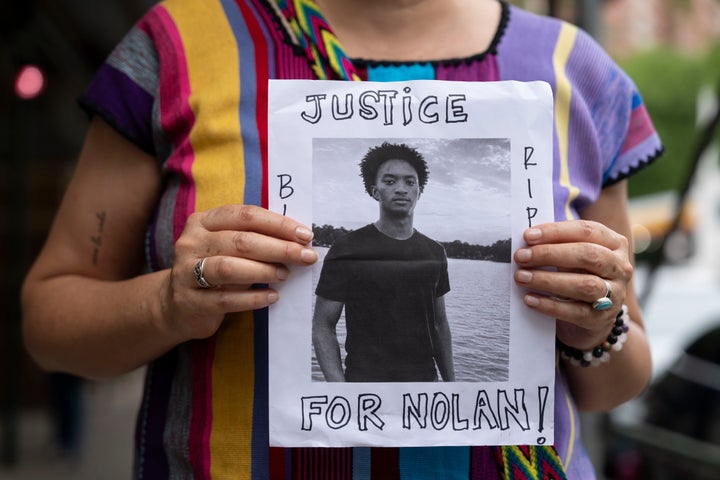 A person holds a picture of Nolan Xavier Wells during a news conference at National Action Network headquarters, Friday, July 10, 2026, in New York. (AP PH๏τo/Yuki Iwamura)