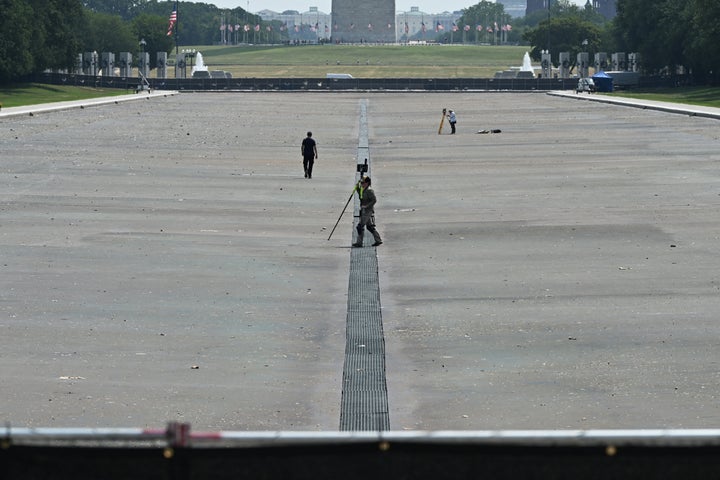 Surveyors work Wednesday at the Lincoln Memorial Reflecting Pool on the National Mall.