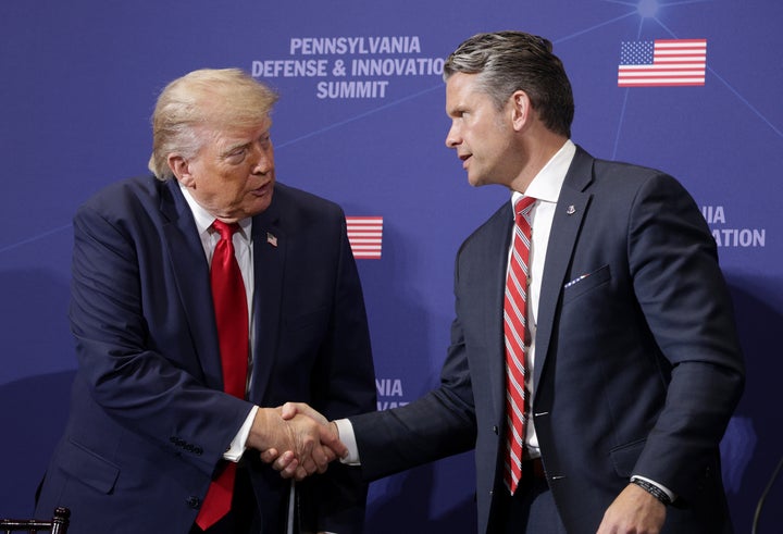 CARLISLE, PENNSYLVANIA - JULY 15: President Donald Trump speaks with Secretary of War Pete Hegseth at the Pennsylvania Defense and Innovation Summit at U.S. Army War College on July 15, 2026 in Carlisle, Pennsylvania. (Photo by Alex Wong/Getty Images)