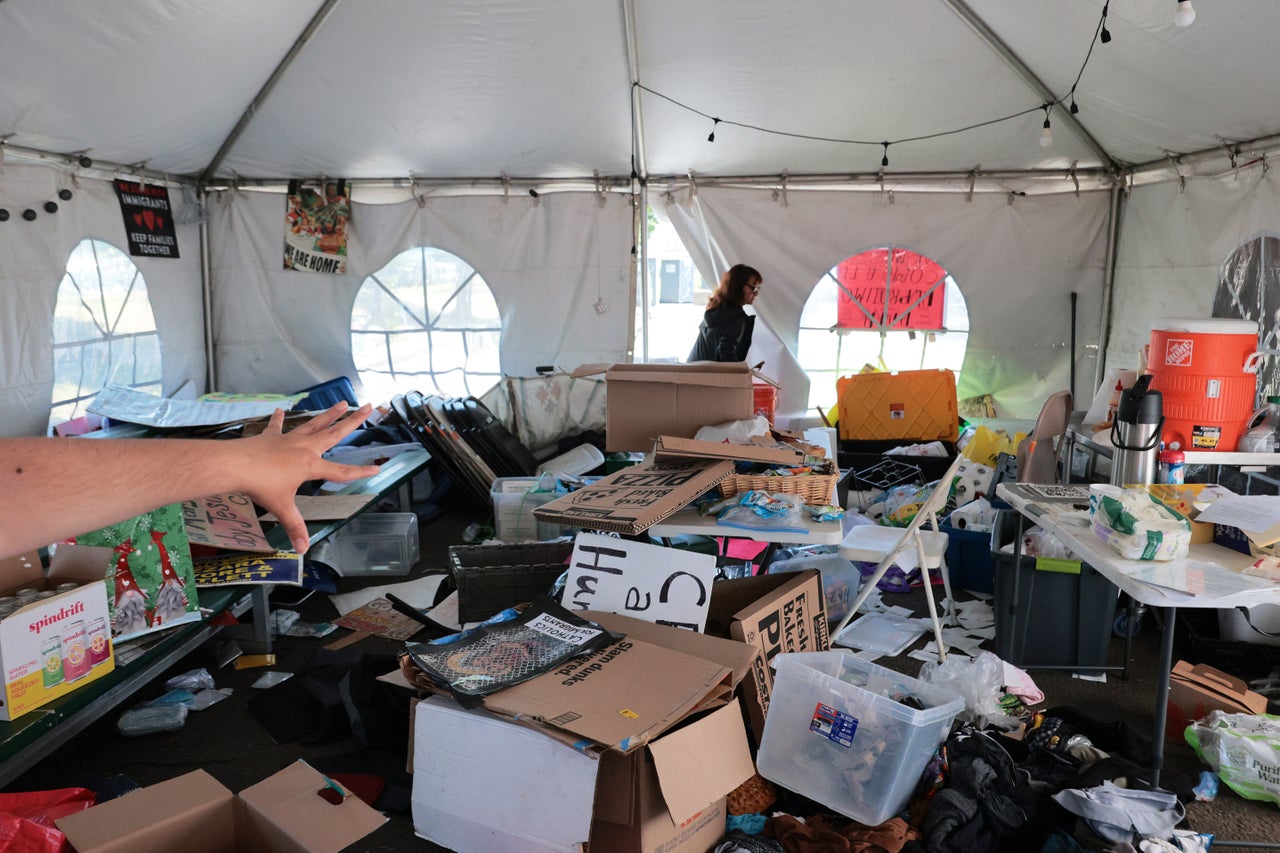 Volunteers with the Eyes on ICE New Jersey coalition tour their mutual aid tent after it was raided by FBI and Homeland Security Investigations agents.