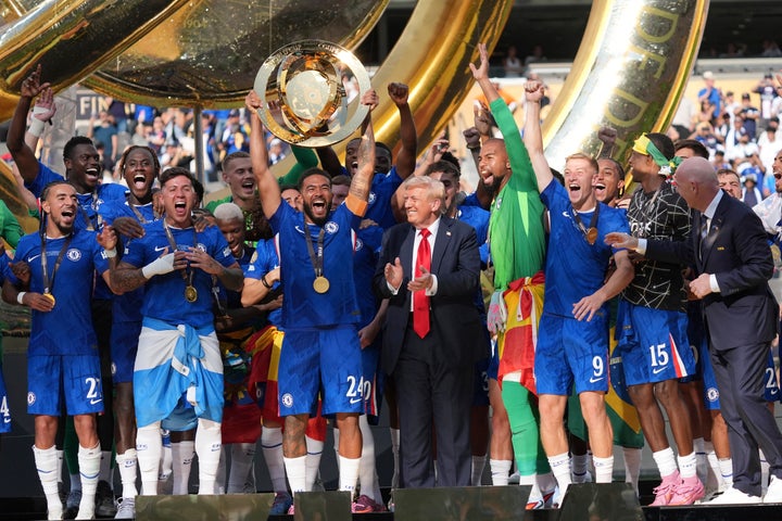 President Donald Trump joins Chelsea as team captain Reece James (24) lifts the Club World Cup trophy at MetLife Stadium on July 13, 2025.