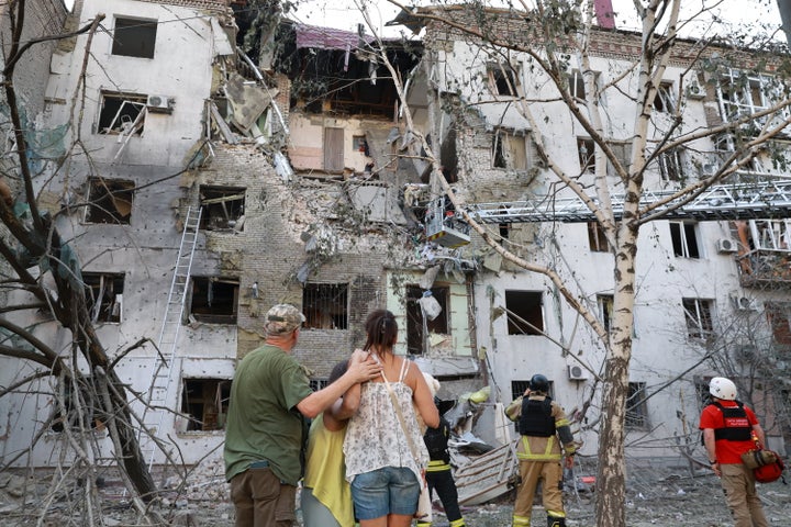 Residents look at their devastated homes after a Russian air-guided bomb attack in Zaporizhia, Ukraine, July 19, 2026.