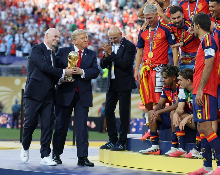Gianni Infantino and Donald Trump bring the World Cup trophy over to the Spanish team after the FIFA World Cup 2026 final match between Spain and Argentina on July 19 in East Rutherford, New Jersey.