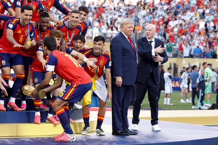 Infantino seemingly trying to get Trump out of the shot on Sunday.