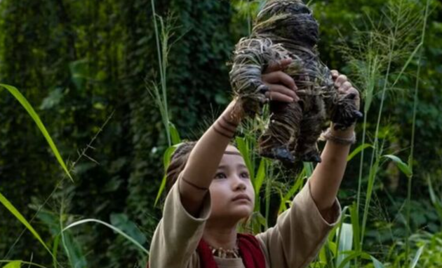 Godzilla vs. Kong star Kaylee Hottle in character as Jia in the 2021 film