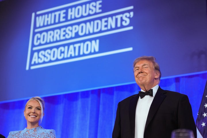 White House press secretary Karoline Leavitt beams beside her boss, President Donald Trump, during Friday’s makeup White House Correspondents’ Association Dinner.