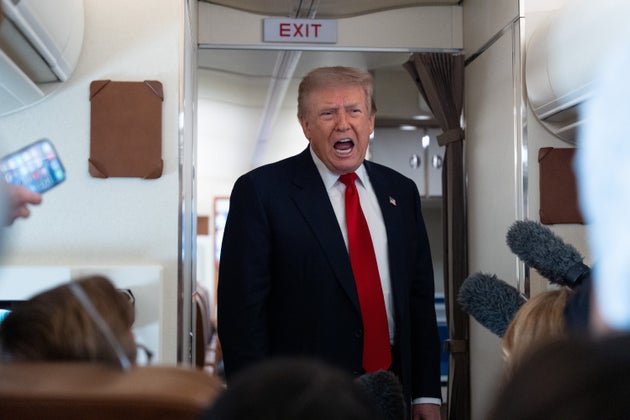 President Donald Trump speaks with reporters on Air Force One on July 27, 2026. 