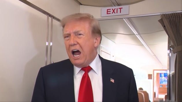 President Donald Trump speaking to reporters aboard Air Force One on July 27, 2026.
