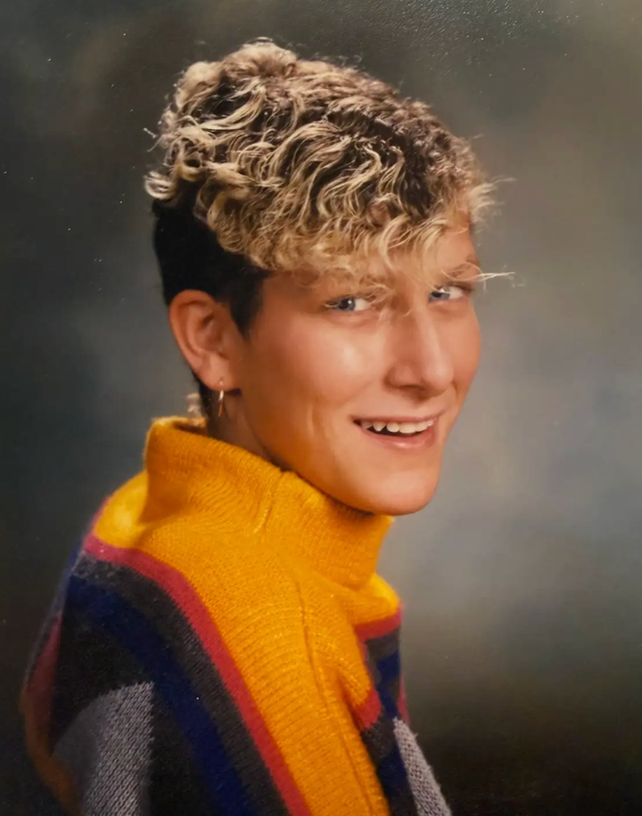 The author, age 18, in their senior high school photo.