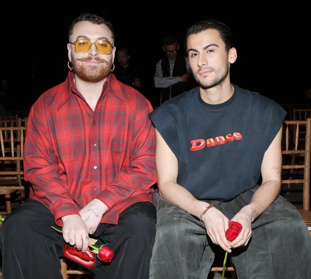 Singer Sam Smith, left, has confirmed their engagement to designer Christian Cowan after about three years of dating. 