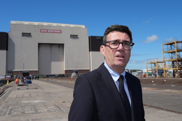 Britain's Prime Minister Andy Burnham looks on during a visit to BAE Systems, Submarine Academy for Skills and Knowledge (SASK), in Barrow in Furness, northern England on July 30, 2026 