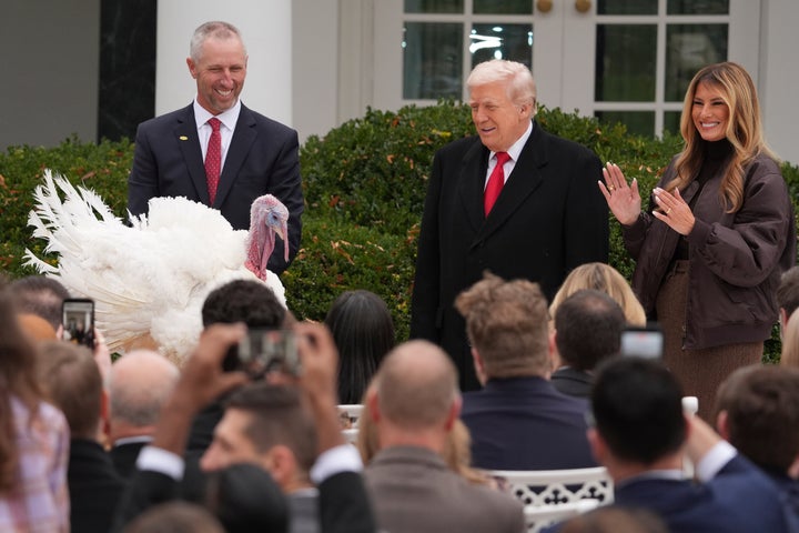 President Donald Trump and first lady Melania Trump stand next to national Thanksgiving turkey Gobble during a pardoning ceremony in the Rose Garden of the White House on Nov. 25, 2025.