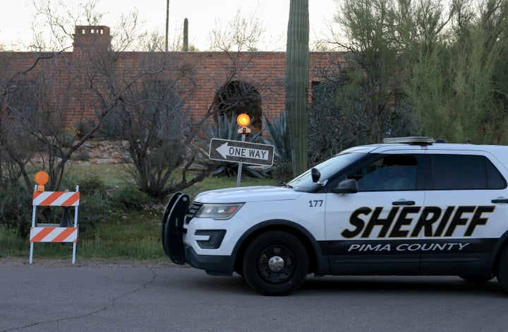 A Pima County Sheriff vehicle drives in front of Nancy Guthrie's residence after a no-parking policy was implemented for the area around the home on February 26, 2026, in Tucson, Arizona. (Photo by Joe Raedle/Getty Images)