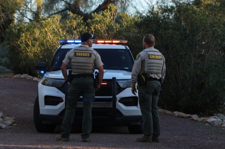 Pima County deputy sherrifs stand in the driveway of the residence of Nancy Guthrie on February 18, 2026, in Tucson, Arizona. (Photo by Joe Raedle/Getty Images)