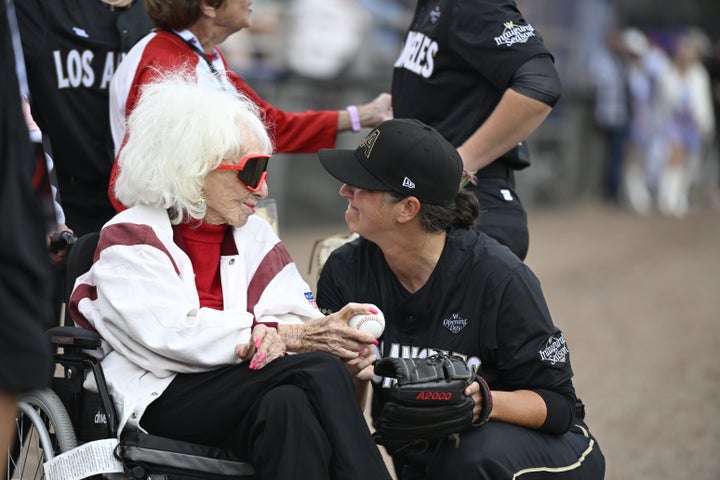 Former All-American Girls Professional Baseball League player Maybelle Blair (left) and Los Angeles Queens' Elodie O'Sullivan (right) share a moment before the start of the inaugural Women's Professional Baseball League game on Saturday. (AP Photo/Lexie Knight)
