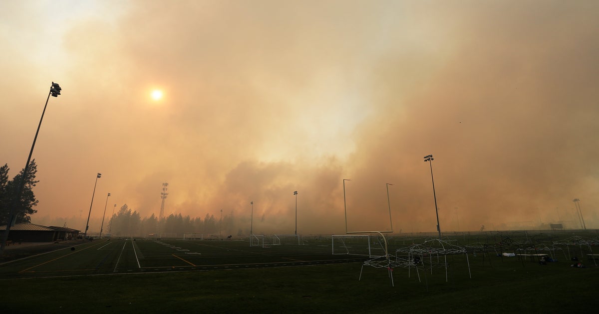 Dozens Of Wildfires Burn In Western States, Prompting Thousands To Flee