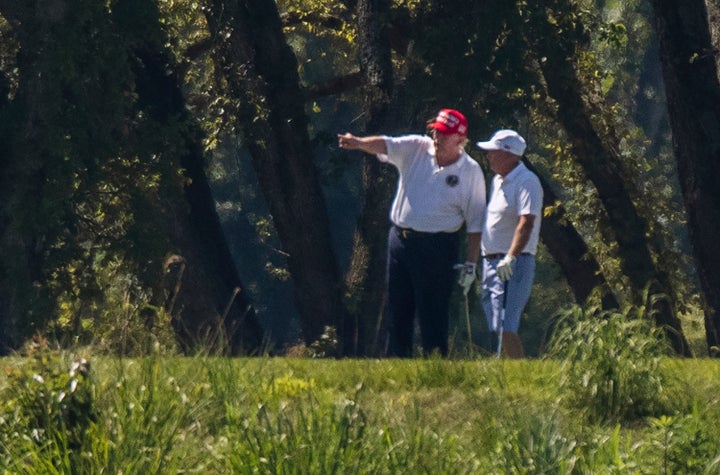 Trump and Lindsey Graham golf at Trump National Golf Club in this 2020 file photo.