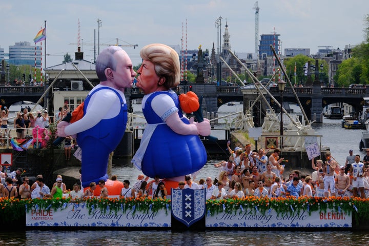 Two inflatable caricature balloons depict U.S. President Donald Trump (right) and Russian President Vladimir Putin (left) as people line the Dutch capital's historic canals.