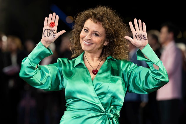Nadia Sawalha raises her hands to display 