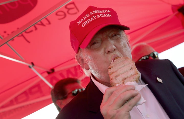 Donald Trump eats a pork chop on a stick at the Iowa State Fair in 2015.