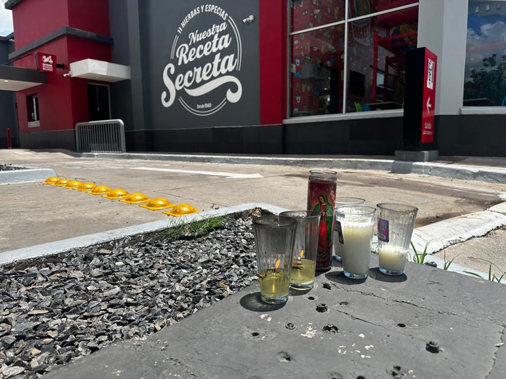 Candles sit near the spot where César Gastélum, a social media influencer, was killed in Culiacán, Mexico.