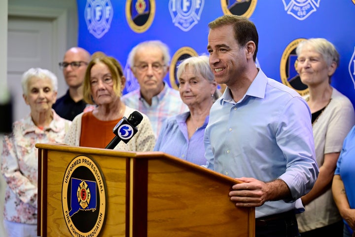 Luke Bronin, former mayor of Hartford and Democratic candidate for U.S. representative, speaks at a news conference with firefighters and teachers on July 23 in West Hartford, Connecticut.