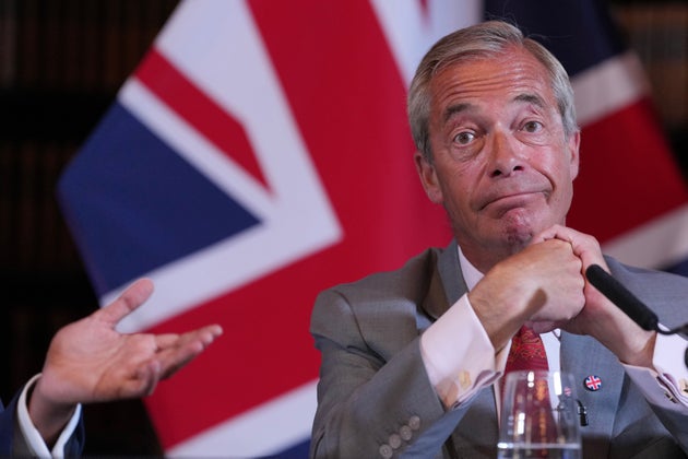Nigel Farage, Leader of Britain's Reform UK party, attends a press conference in London, Monday, Aug. 10, 2026. (AP Photo/Kin Cheung)