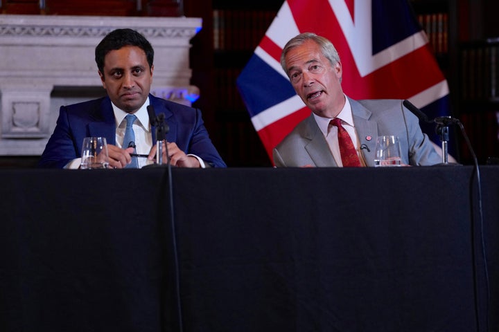 Nigel Farage, Leader of Britain's Reform UK party, right, and Zia Yusuf, Reform UK's spokesperson for home affairs attend a press conference in London, Monday, Aug. 10, 2026. (AP Photo/Kin Cheung)