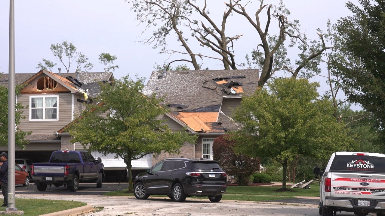 In this image made from video, a roof is damaged after a strong storm in Tinley Park, Ill., on Aug. 11, 2026. 