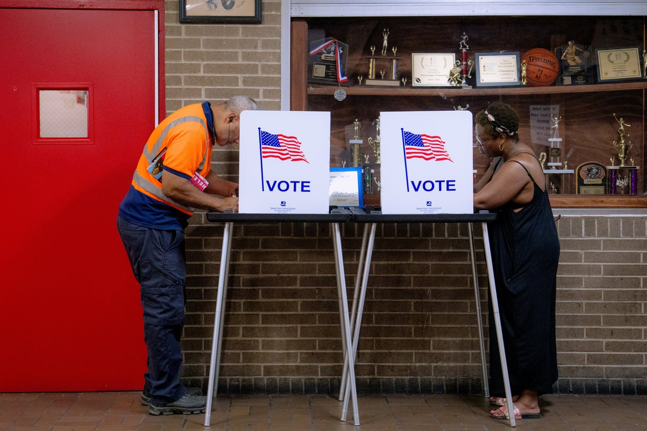 People vote in the primary election at Northwestern High School in Detroit on Aug. 4.