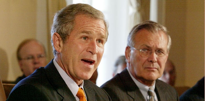 Then-Defense Secretary Donald Rumsfeld, right, was one of the architects of President George W. Bush’s war in Iraq. Photo from 2002. 