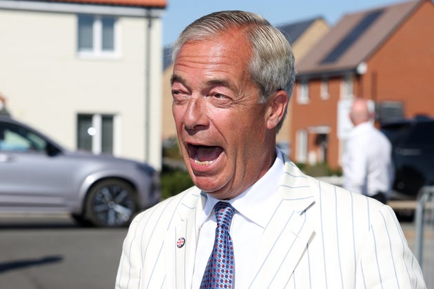 Nigel Farage arrives at a polling station to vote in the by-election.