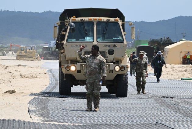 A U.S. Marine leads a military vehicle at a beach during a joint field training exercise conducted by the South Korea-US Combined Forces Command in Pohang on July 15, 2026.
