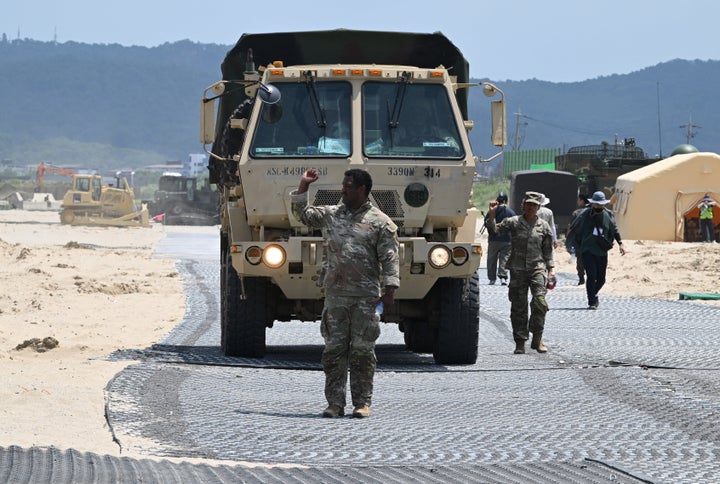 A U.S. Marine leads a military vehicle at a beach during a joint field training exercise conducted by the South Korea-US Combined Forces Command in Pohang on July 15, 2026.