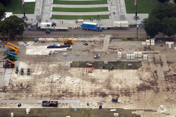 Workers dismantle structures from Salute to America, an Independence Day event honoring the nation’s 250th anniversary, as seen from the Washington Monument, on July 10.