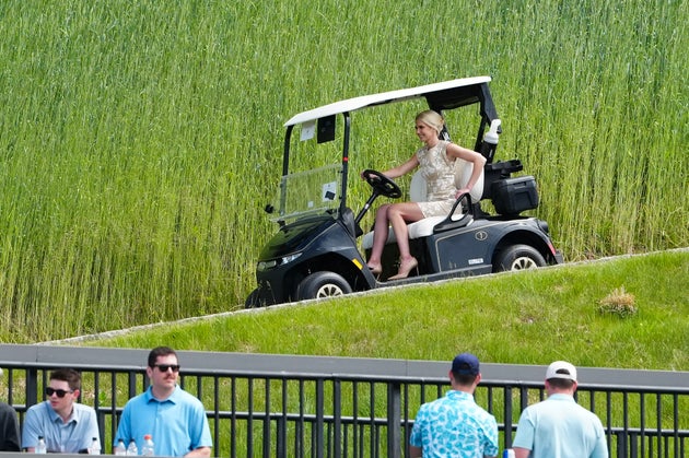 Natalie Harp pilots a golf cart at Trump’s New Jersey course.