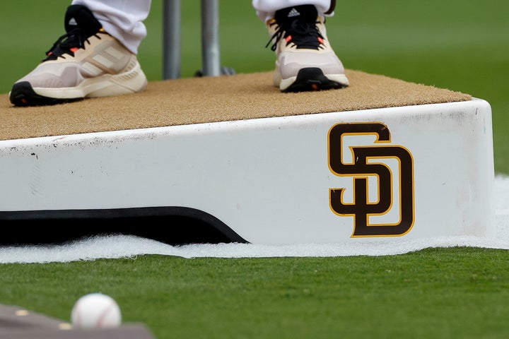 A Venezuelan former baseball player working for theSan Diego Padreswas detained byU.S. immigration officersafter arriving in Texas on a work trip for the club, his family said Tuesday.