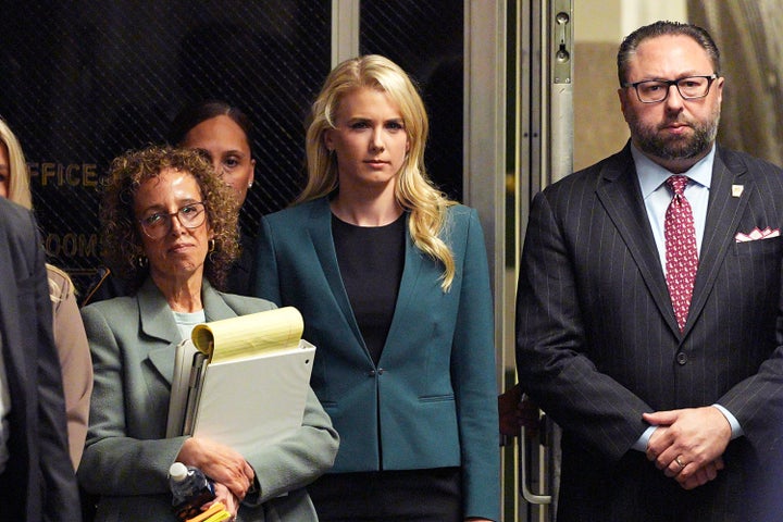 Natalie Harp watches as President Donald Trump speaks to reporters at a Manhattan courthouse in April 2024. 