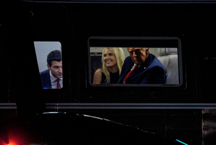 Donald Trump and aide Natalie Harp look out the window of Marine One on Sept. 18, 2025 in Washington, DC.