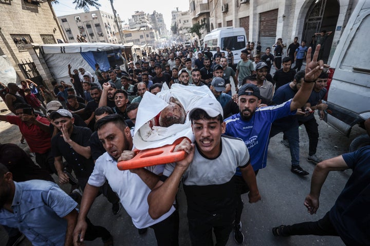 Relatives mourn Palestinian officer Ayman Jundiya, who was killed in an Israeli attack on a police station, during a funeral ceremony in Gaza City on Aug. 19, 2026. The death toll from the attack rose to nine, with 15 others reported injured.