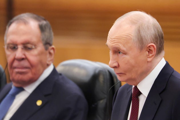 Russian President Vladimir Putin, right, and Sergei Lavrov